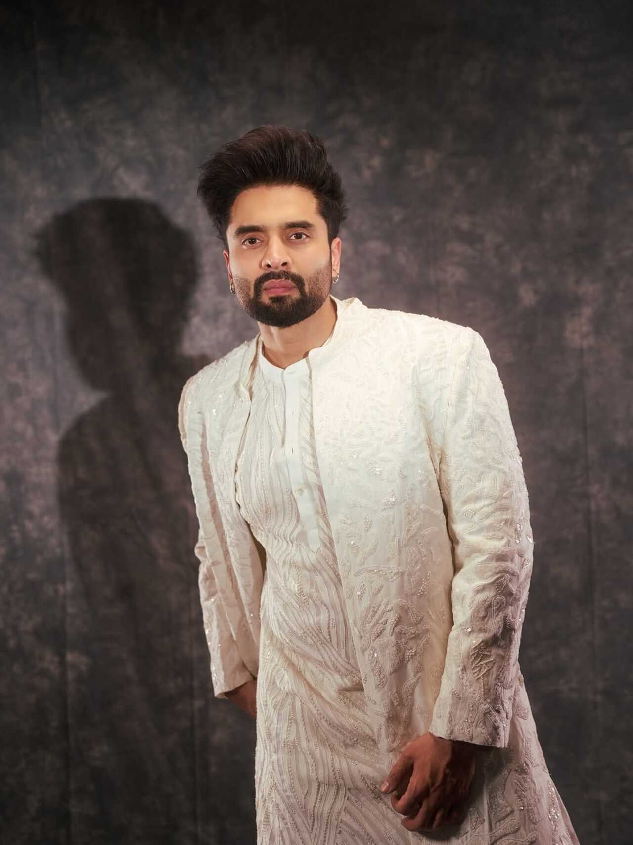 <p>Elegant and timeless, Jackky&rsquo;s ivory ensemble speaks of quiet luxury. The textured detailing and structured layering lend a regal charm, making this look ideal for celebrations.</p>